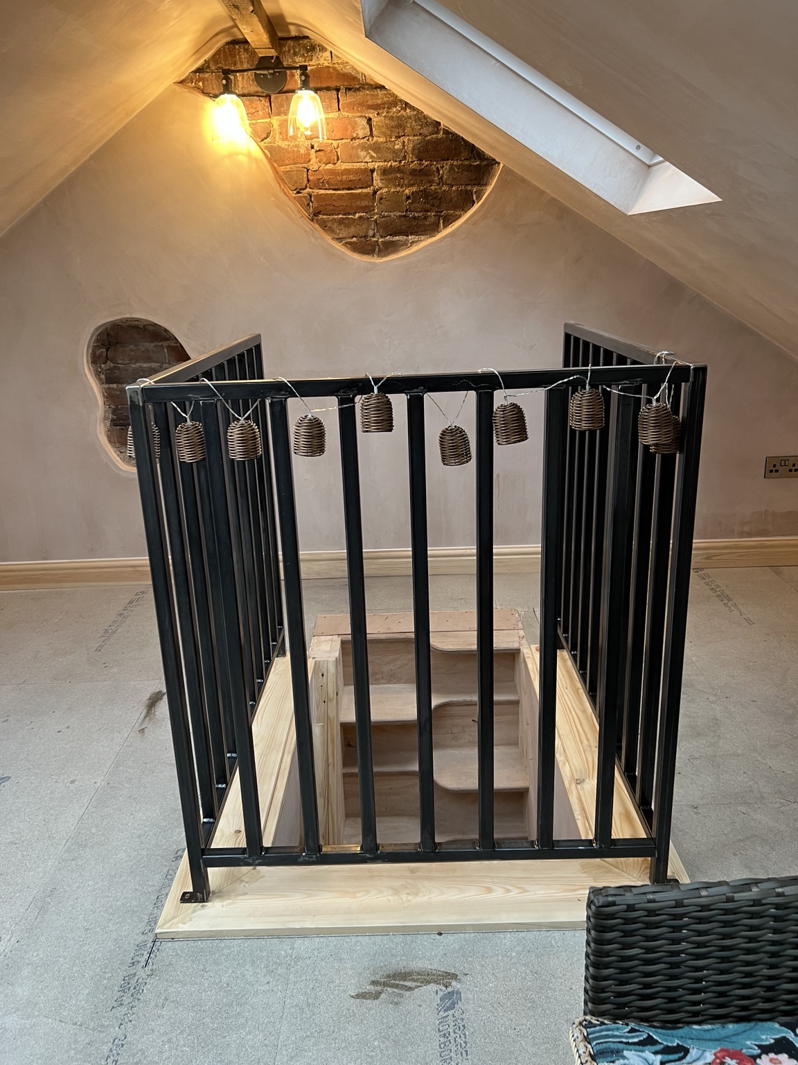 The loft staircase and dark balustrades