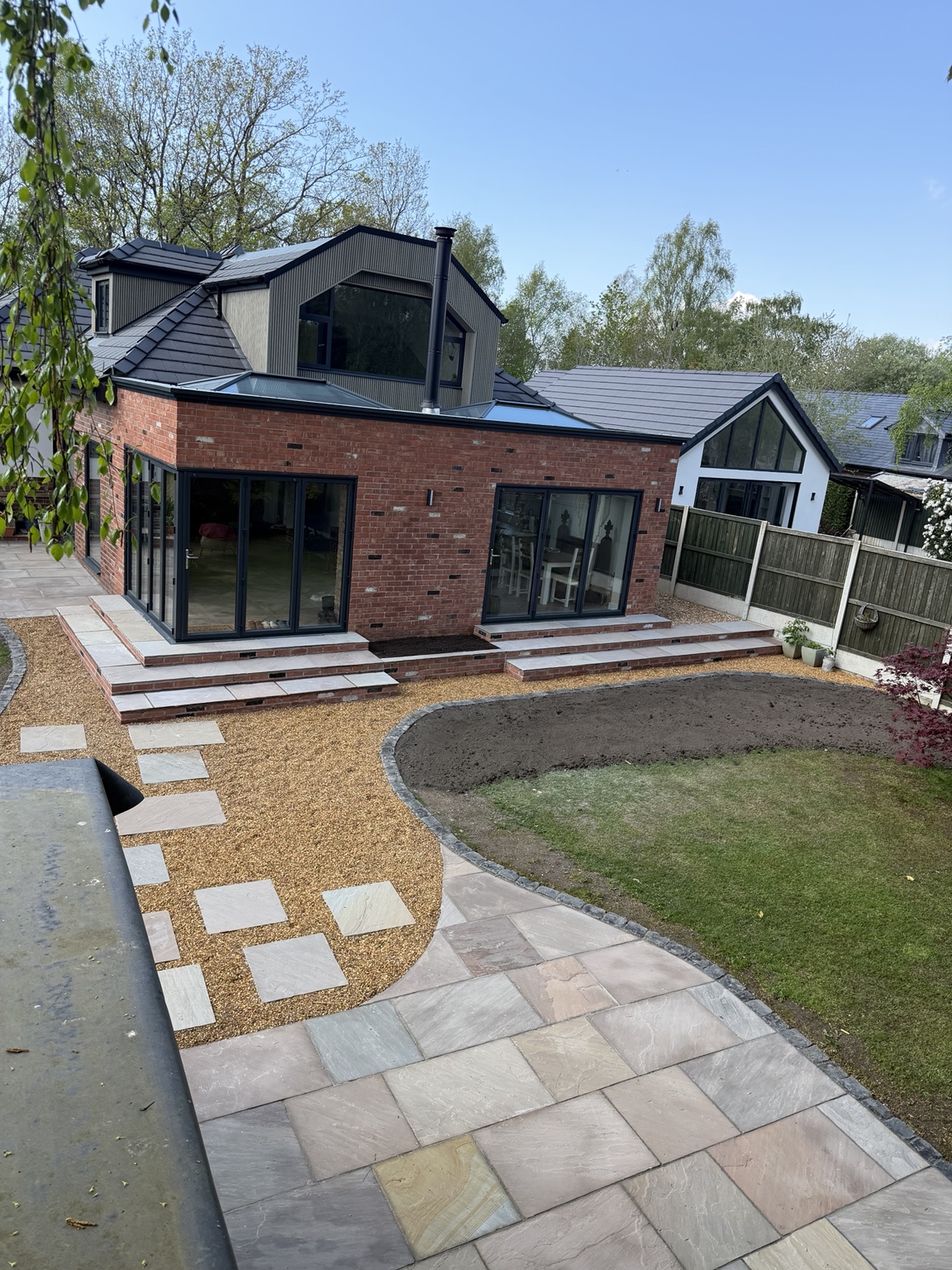 Paved steps, gravel paths and curved garden edging